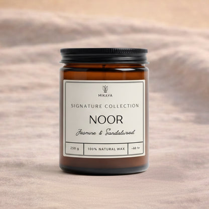 Noor jasmine and sandalwood scented jar candle in amber glass